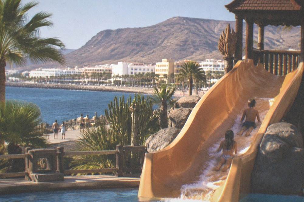 Children on a water slide at a Thai-themed water park in south Tenerife