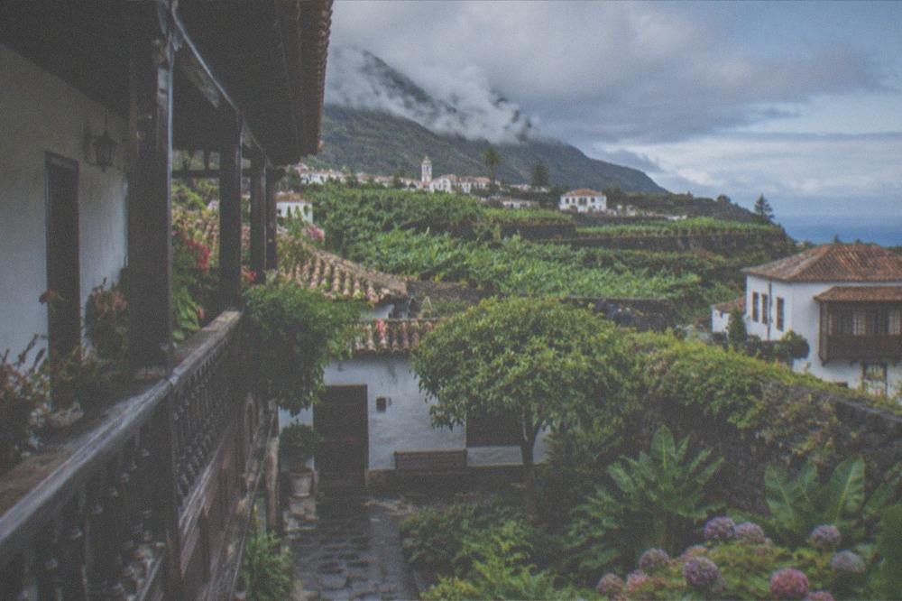 A traditional Canarian courtyard with a wooden balcony in La Orotava