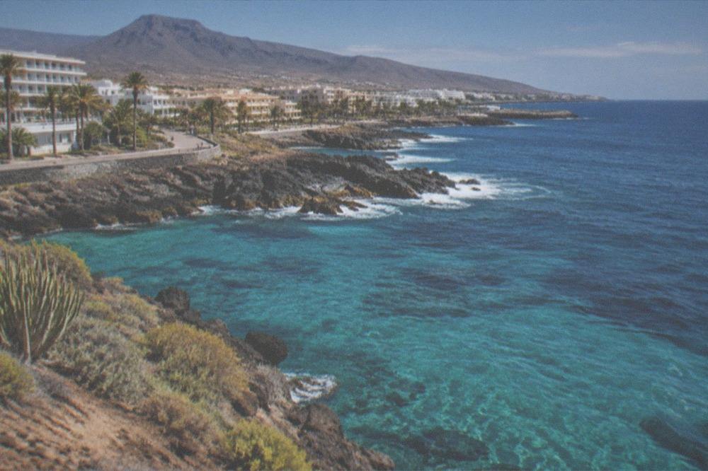 Clear turquoise water seen from above with sunlight patterns on the surface near the Tenerife shore