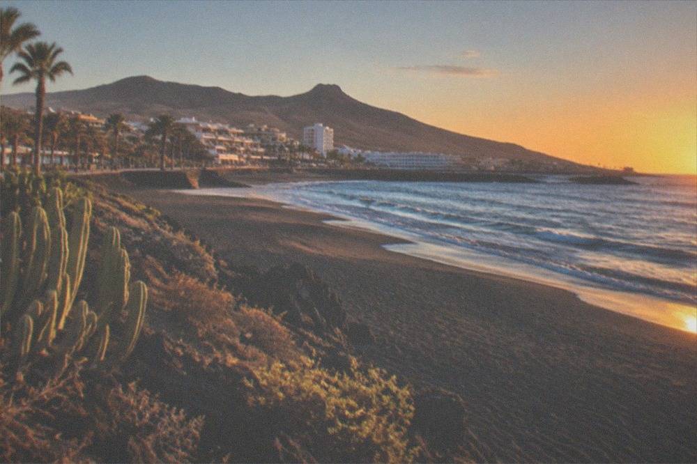 Empty beach at dawn with a light offshore wind ruffling small waves